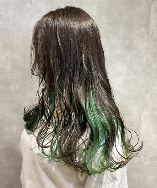 long hairstyle with green highlights